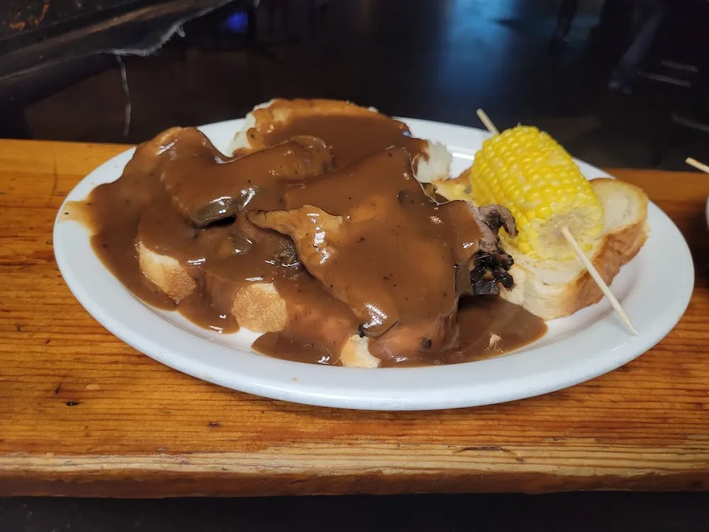 Open Faced Roast Beef Sandwich with Mashed Potatoes and Brown Gravyand a Vegetable